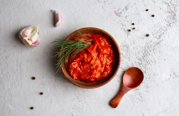 Balkan snack of bell pepper Ajvar on a light background