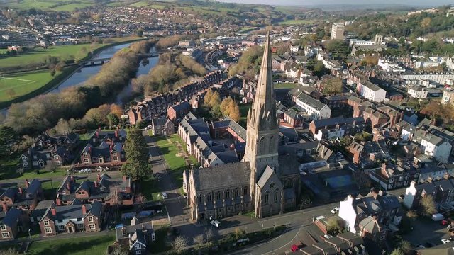 Aerial of the River Exe and a beautiful nearby church in the foreground. 