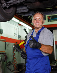 Confident male mechanician