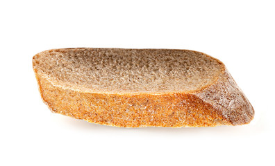 Freshly baked bread isolated on a white background. Crumbs and Bread slice close up. Top view.