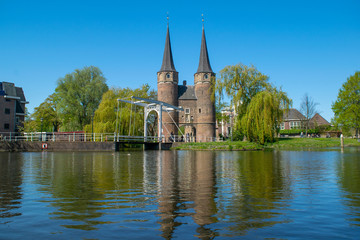 A view from the canal of the Oostpoort (east gate) in the city of Delft.