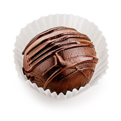 Chocolate round candy  covered with chocolate stripes isolated on white background, macro