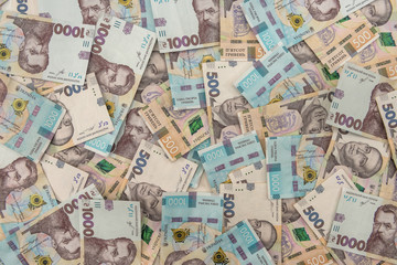 seamless texture of real new ukraine 500 and 1000 banknotes. Pile of hryvnia as financial background.