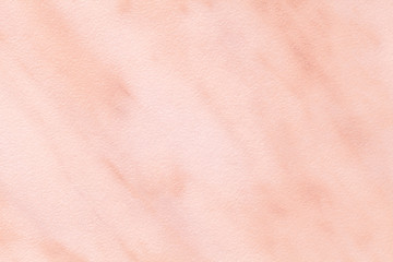 Texture of light pink marble with white lines of a pattern, macro background. Pastel rose color stone backdrop.