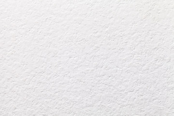 Texture of white decorative plaster with cracked pattern, macro background. Structure of ivory stucco backdrop.