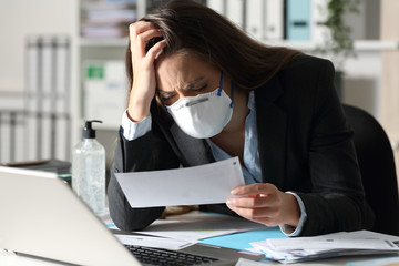 Sad executive with mask complaining looking receipt