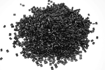 Black Plastic polymer granules isolated on white 