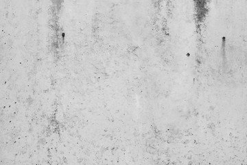White concrete wall with black stains as background