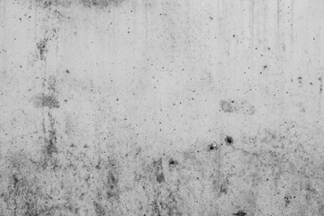 White concrete wall with black stains as background