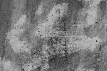 White concrete wall with black stains as background