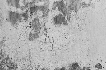 White concrete wall with black stains as background