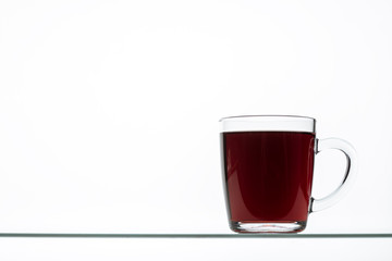 sliced pieces of raw beet and beetroot juice in glass on plate isolated on white background, close view root