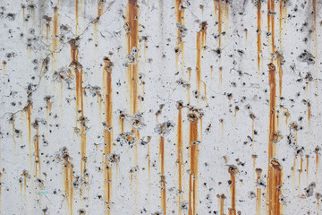 White concrete walls with rust stains as the background