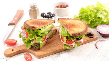 sandwich with lettuce, tomato, cheese and ham