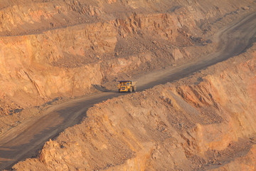 Road with a truck in an iron ore quarry