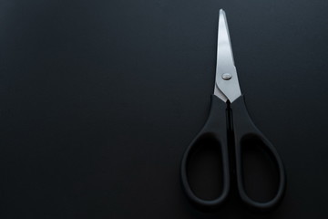 office scissors on a black background
