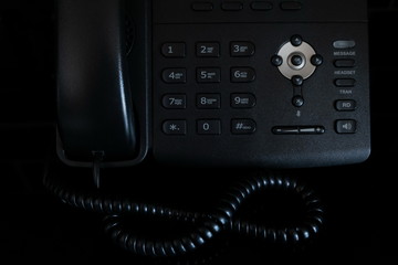 close-up of a black phone on a black background