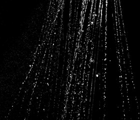 Splashes and drops of water are on a black background.