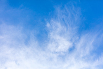 White clouds on a blue sky as background