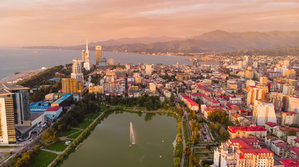 Fototapeta na wymiar Aerial view of Batumi city with lake and port in sunset. Gerogia