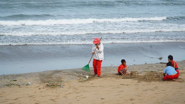 Janitor is carrying out activities Kuta Beach, Bali, Indonesia, January 29, 2017.