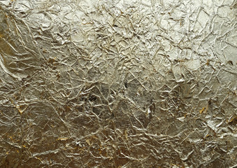 Wrinkled texture background. Golden with a copper tint antique handmade  crumpled paper. Potal, jammed foil.