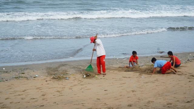 Janitor is carrying out activities Kuta Beach, Bali, Indonesia, January 29, 2017.