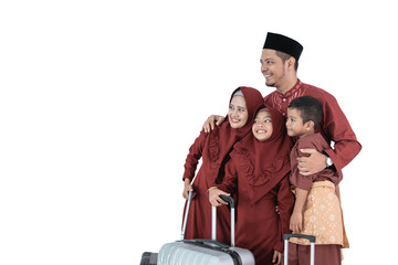 Plakat Asian Muslim family after packing clothes with suitcases to carrying mudik to their hometown