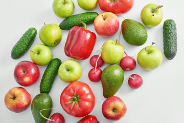 Different vegetables and fruit isolated on white background.