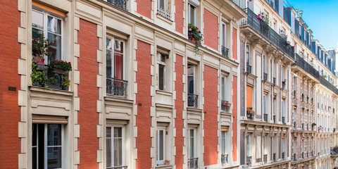 Fototapeta na wymiar Paris, beautiful building in Montmartre, with typical orange brick on the facade 