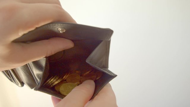 Opening wallet, looking for euro coins.