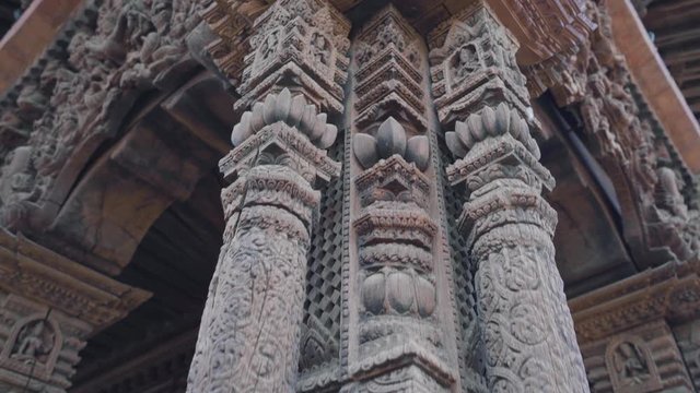 Ancient Wooden Carving At The Columns In A Temple On Durbar Square In Patan, Kathmandu Valley, Nepal - Tilt-up Shot