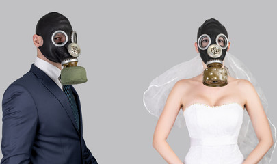 Wedding during the coronavirus period. Bride and groom in protective medical masks