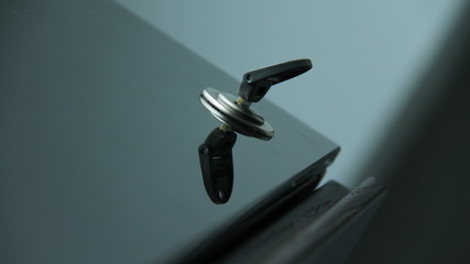 Reflection of a key on a table