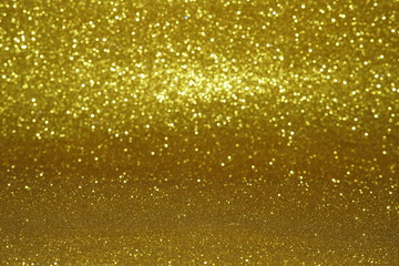 gold Sparkling Lights Festive background with texture. Abstract Christmas twinkled bright bokeh defocused and Falling stars. Winter Card or invitation	