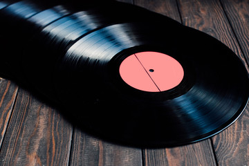 Vinyl records on a wooden background