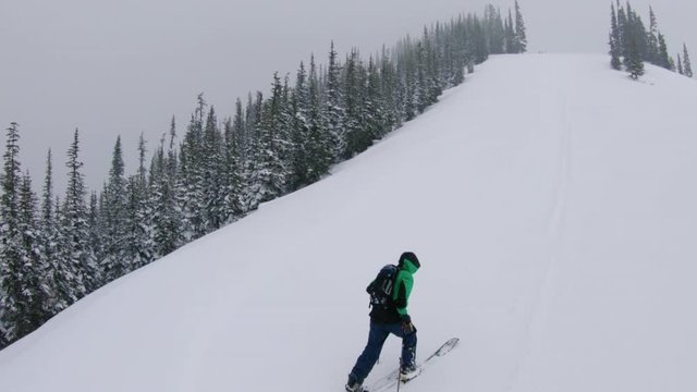 Extreme Mountain Escape Aerial Hiking Snowy Slope in Thick Snowfall