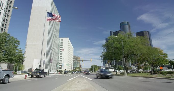 Timelapse Sunny Day Traffic And Flag From Detroit Street