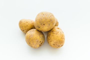 top view of a group potatoes on white background...