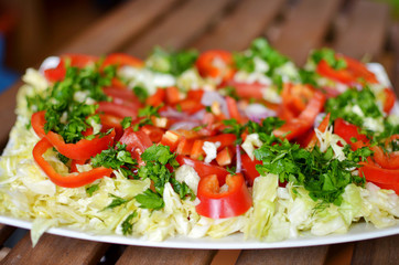 fresh vegetable salad  with carrots, peppers and cabbage