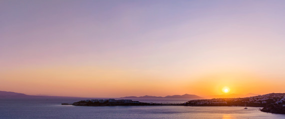 Obraz premium Beautiful Golden Sunset over the Sea .Sea Landscape with Orange Sun and Calm Water