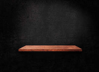 Blank of old wooden shelf on dark wall texture background with clipping path for design