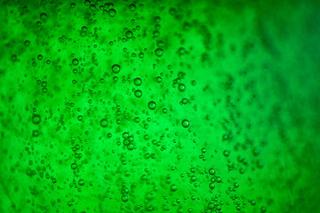 green fluid with bubbles science research