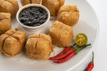 fried tofu with minced beef meet on white porcelain plate white background