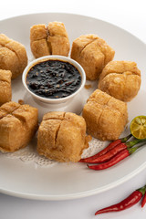 fried tofu with minced beef meet on white porcelain plate white background