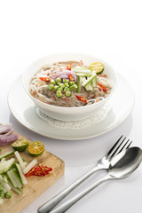 laksa with thick noodles and chicken on white bowl and background