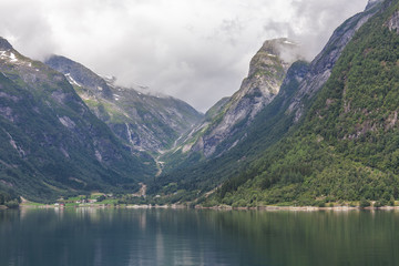 End of fjord. Beautiful Norwegian landscape. view of the fjords. Norway ideal fjord reflection in clear water In cloudy weather. selective focus