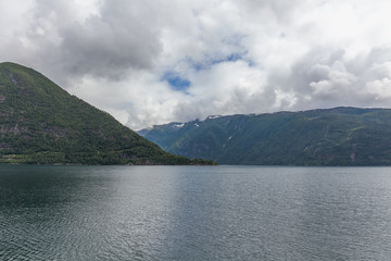 End of fjord. Beautiful Norwegian landscape. view of the fjords. Norway ideal fjord reflection in clear water In cloudy weather. selective focus
