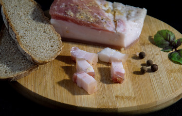 lard with gray bread on the board
