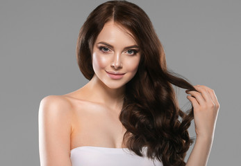 Beautiful glamour woman long curly hair black dress fashion natural make up female beauty